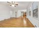 Open dining room with hardwood floors and views to the kitchen at 5235 Shadow Path Sw Ln, Lilburn, GA 30047