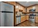 Updated kitchen with stainless steel appliances and wood cabinets at 1642 Cecilia Se Dr, Atlanta, GA 30316