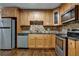 Modern kitchen featuring granite countertops and wood cabinets at 1642 Cecilia Se Dr, Atlanta, GA 30316