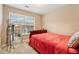 Cozy bedroom with red bedding and large window at 1006 Manchester Way, Roswell, GA 30075