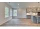 Bright dining area with hardwood floors and large windows at 203 Arabella Pkwy, Locust Grove, GA 30248