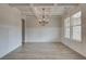 Formal dining room featuring hardwood floors and a chandelier at 203 Arabella Pkwy, Locust Grove, GA 30248