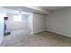 Spacious finished basement with a fireplace and neutral carpeting at 2076 Scarbrough Dr, Stone Mountain, GA 30088