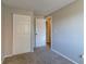 Well-lit bedroom with double door closet and neutral decor at 2076 Scarbrough Dr, Stone Mountain, GA 30088