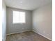 Bright bedroom featuring neutral walls and brown carpeting at 2076 Scarbrough Dr, Stone Mountain, GA 30088