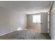 Spacious bedroom with neutral walls and carpeting at 2076 Scarbrough Dr, Stone Mountain, GA 30088