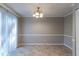 Dining room with neutral walls, tile floor and a window with blinds at 2076 Scarbrough Dr, Stone Mountain, GA 30088