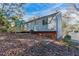 Side view of house, showcasing deck and yard at 2076 Scarbrough Dr, Stone Mountain, GA 30088