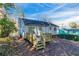 Back of house with a deck and wooded backyard at 2076 Scarbrough Dr, Stone Mountain, GA 30088