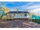 Rear view of house, showing deck and yard at 2076 Scarbrough Dr, Stone Mountain, GA 30088