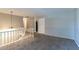 Living area showcasing neutral wall paint, carpeting and a staircase at 2076 Scarbrough Dr, Stone Mountain, GA 30088