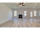 Living room with fireplace and wood-look flooring at 231 Linford Dr, Locust Grove, GA 30248