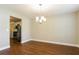 Formal dining room with hardwood floors and a chandelier at 4125 Bradford Walk Trl, Buford, GA 30519