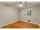 Well-lit bedroom featuring hardwood floors and ceiling fan at 4800 Kenilworth Dr, Stone Mountain, GA 30083