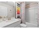 Clean bathroom with a tub/shower combo and zebra print shower curtain at 236 Ruthe Cvs, Locust Grove, GA 30248