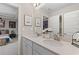 Double vanity bathroom with white cabinets and quartz countertops at 236 Ruthe Cvs, Locust Grove, GA 30248