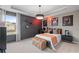 Stylish bedroom with a king-size bed and basketball theme at 236 Ruthe Cvs, Locust Grove, GA 30248