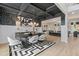 Modern dining room with black and white geometric rug and statement lighting at 236 Ruthe Cvs, Locust Grove, GA 30248