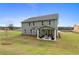 Two-story house with covered patio and landscaped yard at 236 Ruthe Cvs, Locust Grove, GA 30248