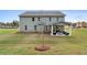 Two-story house with covered patio and landscaped yard at 236 Ruthe Cvs, Locust Grove, GA 30248