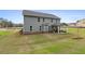 Two-story house with covered patio and landscaped yard at 236 Ruthe Cvs, Locust Grove, GA 30248