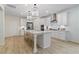 Modern kitchen with white cabinets, quartz countertops and stainless steel appliances at 236 Ruthe Cvs, Locust Grove, GA 30248