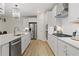 Modern kitchen with stainless steel appliances and white shaker cabinets at 236 Ruthe Cvs, Locust Grove, GA 30248