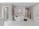 Elegant main bathroom with soaking tub, shower, and marble tile at 236 Ruthe Cvs, Locust Grove, GA 30248