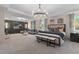 Main bedroom with sitting area, large bed, and ensuite bath at 236 Ruthe Cvs, Locust Grove, GA 30248