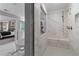 Large walk-in shower with marble tile and built-in seat at 236 Ruthe Cvs, Locust Grove, GA 30248