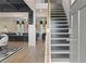 Elegant staircase with dark wood treads and light wood railing at 236 Ruthe Cvs, Locust Grove, GA 30248