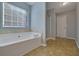 Bathroom with a garden tub and shower at 3188 Arbor Oaks Way, Snellville, GA 30039