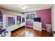 Purple bedroom with hardwood floors and built-in bunk bed at 2956 Hogan Rd, East Point, GA 30344