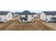 Backyard view of two-story home with a patio at 988 Blue Juniper Cir, Loganville, GA 30052