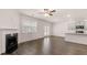 Spacious living room with fireplace and hardwood floors at 988 Blue Juniper Cir, Loganville, GA 30052