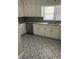 Updated kitchen with white cabinets and patterned tile floor at 73 Pat Mell Sw Rd, Marietta, GA 30060