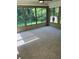 Sunroom with wall-to-wall windows and carpeted floor at 73 Pat Mell Sw Rd, Marietta, GA 30060