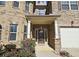 Inviting front entrance with a decorative door and landscaping at 4560 Lake Hill Trl, Ellenwood, GA 30294