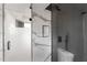 Stylish basement bathroom, featuring marble and dark gray tile at 4366 Skyland Ne Dr, Atlanta, GA 30342