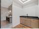 Modern bathroom wet bar with dark countertop and light cabinets at 4366 Skyland Ne Dr, Atlanta, GA 30342