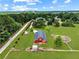 Farm with red barn and riding arena at 2054 Cook Rd, Oxford, GA 30054