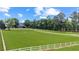 Brick house with white fence and expansive lawn at 2054 Cook Rd, Oxford, GA 30054