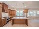 Modern kitchen with wood cabinets, quartz countertops, and island at 335 4Th Ne St, Atlanta, GA 30308