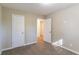 Bright bedroom with carpet flooring and neutral walls at 5382 Kemper Pl, Stone Mountain, GA 30088