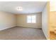 Spacious bedroom with neutral walls and carpet at 5382 Kemper Pl, Stone Mountain, GA 30088