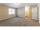 Bright bedroom featuring a large window and en-suite bathroom at 5382 Kemper Pl, Stone Mountain, GA 30088