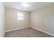 Simple bedroom with carpeted floor and a window at 5382 Kemper Pl, Stone Mountain, GA 30088