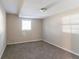 Simple bedroom with carpeted floor and a window at 5382 Kemper Pl, Stone Mountain, GA 30088