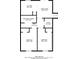 Open floor plan with kitchen, dining area, and two bedrooms at 5382 Kemper Pl, Stone Mountain, GA 30088