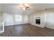 Spacious living room with vaulted ceiling, fireplace, and hardwood floors at 5382 Kemper Pl, Stone Mountain, GA 30088